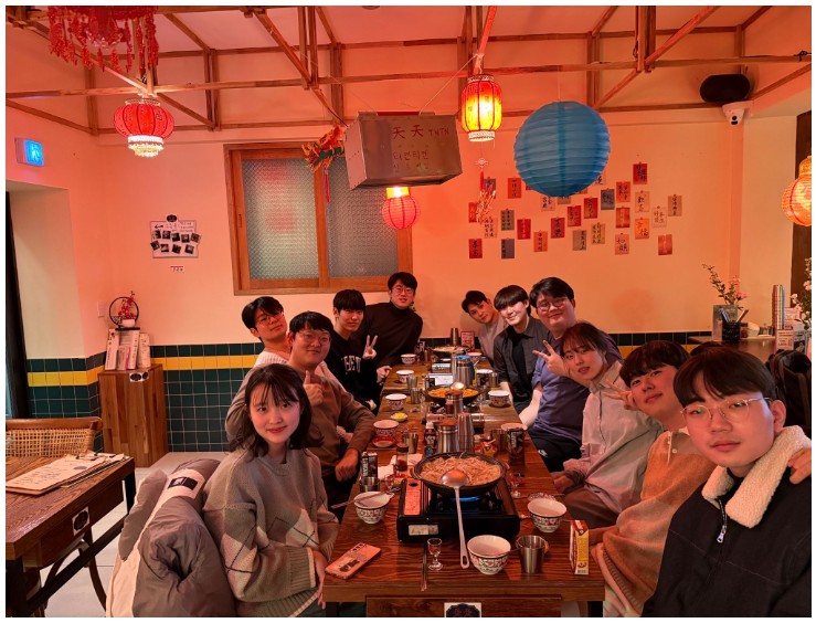 Group dinner photo marking the end of 2024 and start of 2025