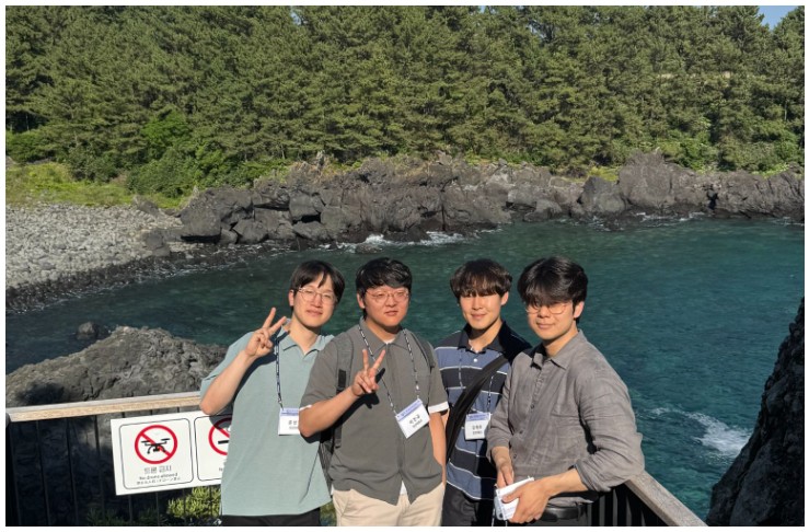 Group photo at a coastal overlook during the KSIEC conference